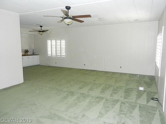 LIVING ROOM LOOKING INTO DINING AREA