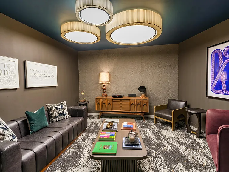 Immerse in sound at Modera EaDo's music room, complete with a record player and acoustic walls for the ultimate listening experience.