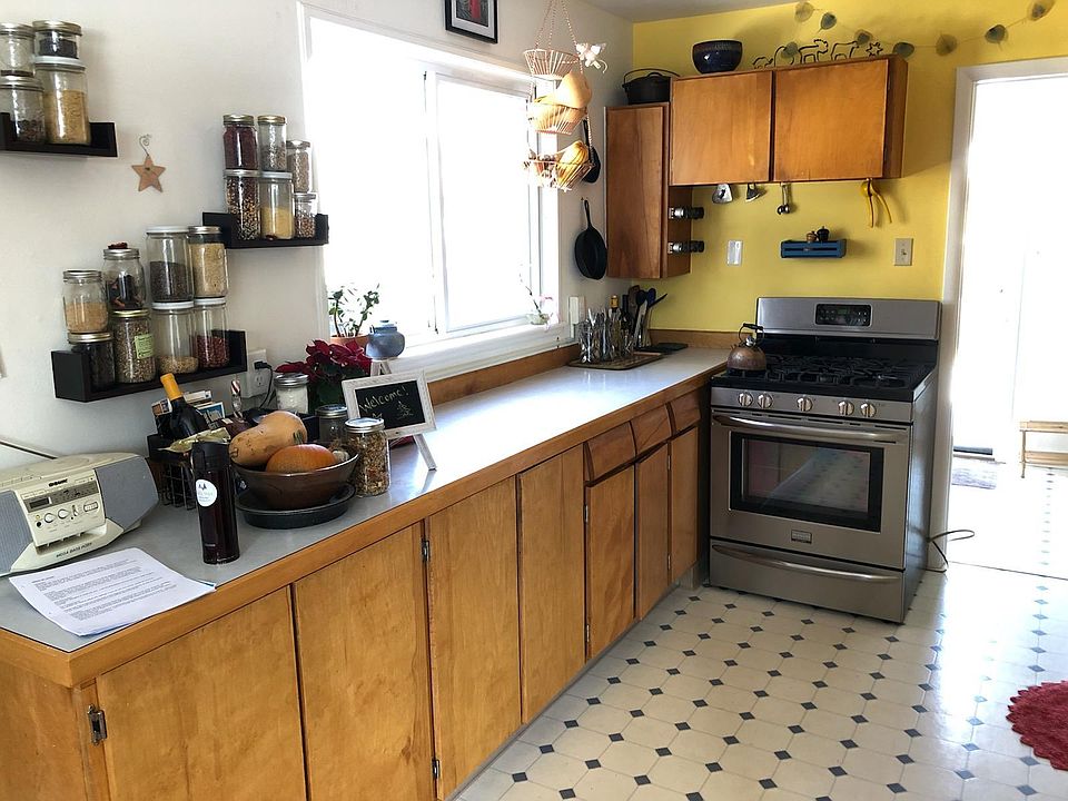 Kitchen with gas stove and new dishwasher! Window has a well-attended birdfeeder outside.