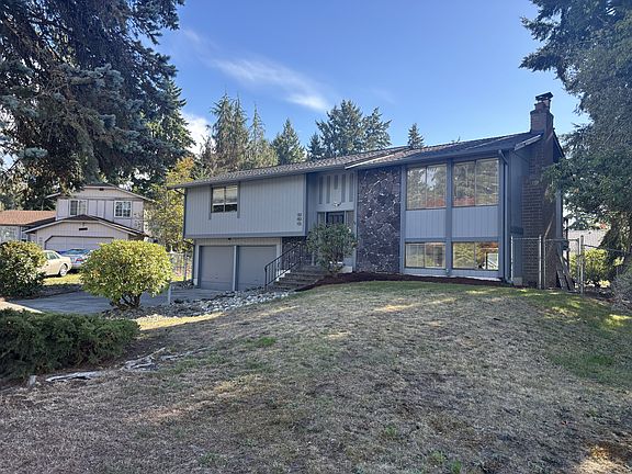 Full front yard view, highlighting the new exterior paint and roof.