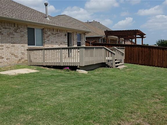 Large porch is the perfect setting for relaxing while enjoying the view.