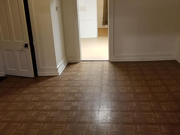 Living room, closet, and door to kitchen