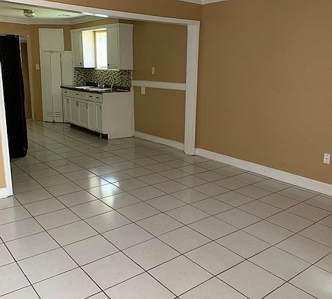 View from front door looking into open dining and kitchen.