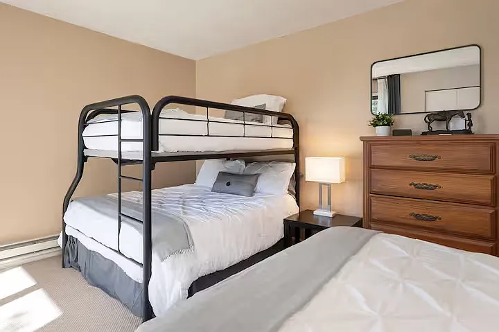 Bunk Room with Queen Bed and Twin over Full Bunk Beds. This room has a dedicated bathroom.