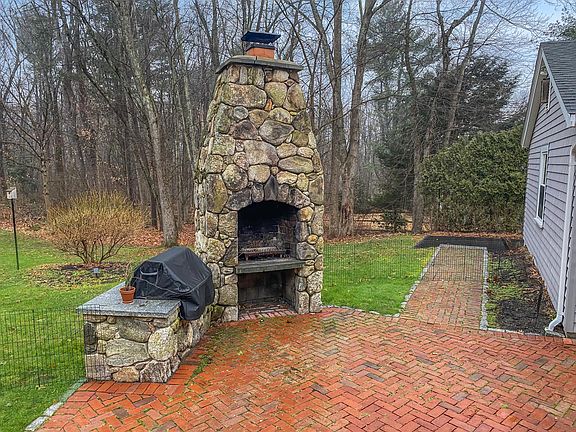 Patio with gas grill and fireplace