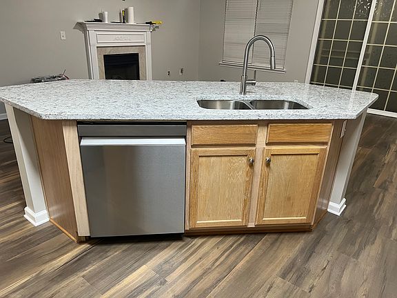 Kitchen view to family room (new granite counter tops and dishwasher)
