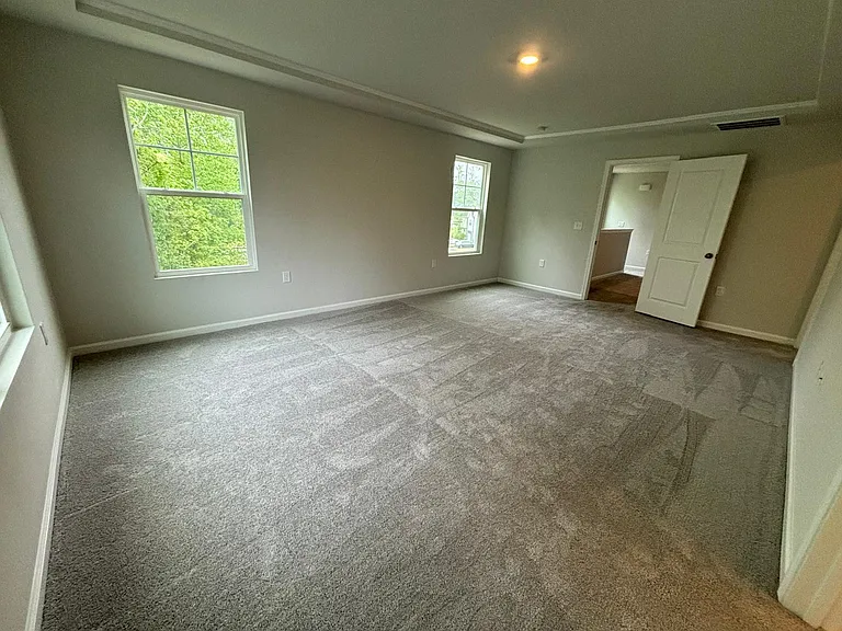 Primary bedroom with lots of natural light
