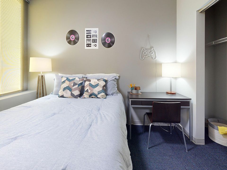 Spacious Carpeted Bedroom at University Plaza NIU Student Apartments