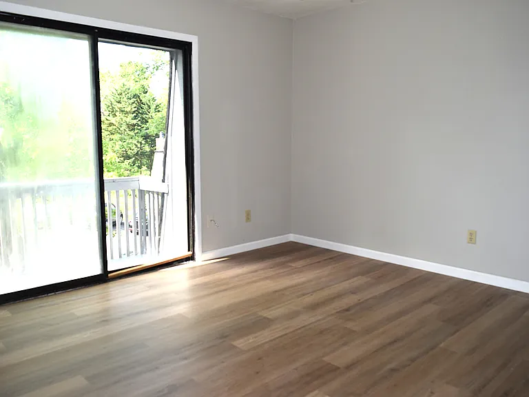 Upstairs bedroom #1 with balcony.