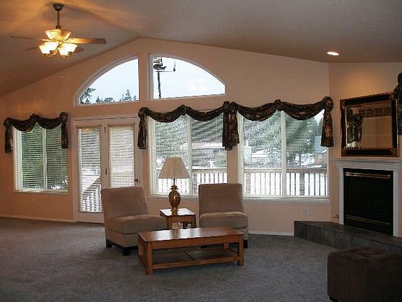 Living rm w/ door leading out to deck