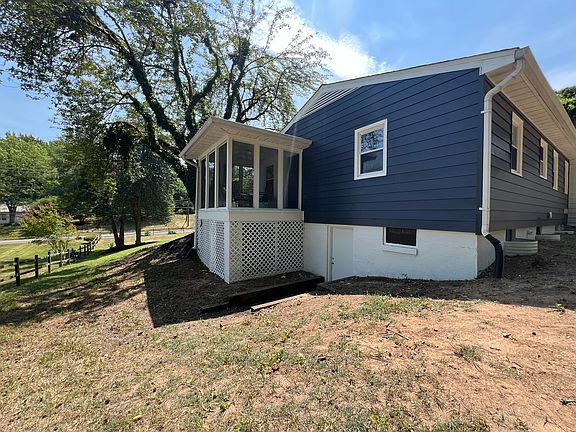Rear view of screened porch. Very private back yard backed by all woods.