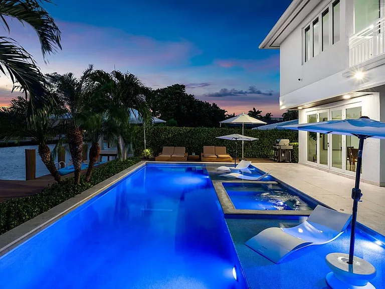 Experience twilight perfection as the pool's reflections mirror the sky.