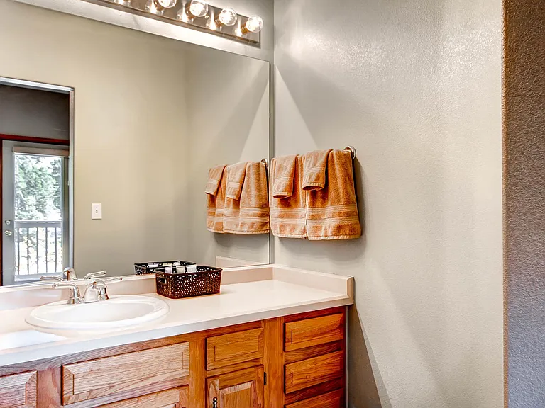 Third floor bedroom with private vanity and bathroom