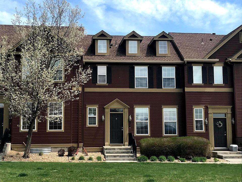 Front of town-home faces west with unobstructed view looking across large lawn (HOA serviced).