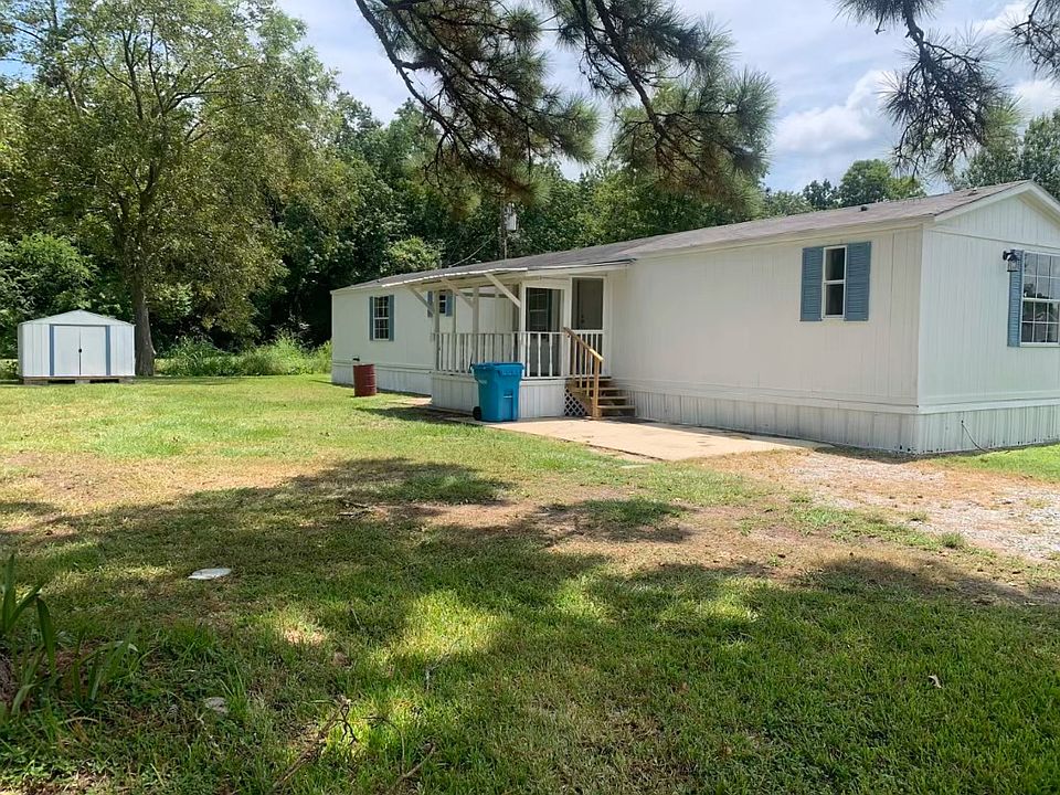 Large Yard with Porch and Storage Shed