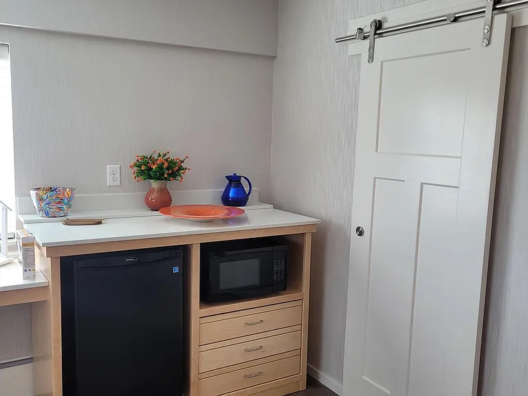 slider door on bathroom in small studio
kitchenette