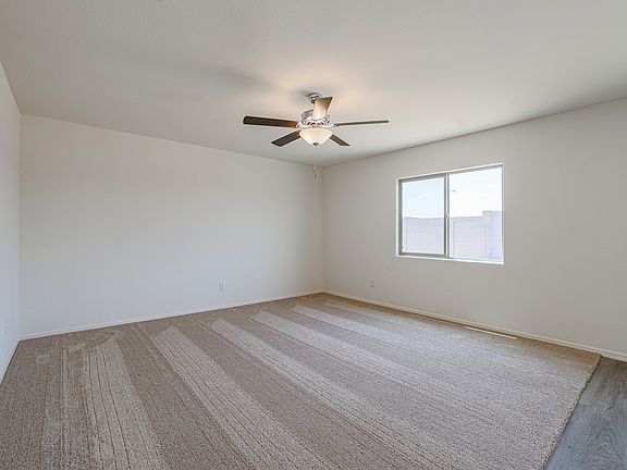 The living room offers the perfect space for lounging with friends and family.