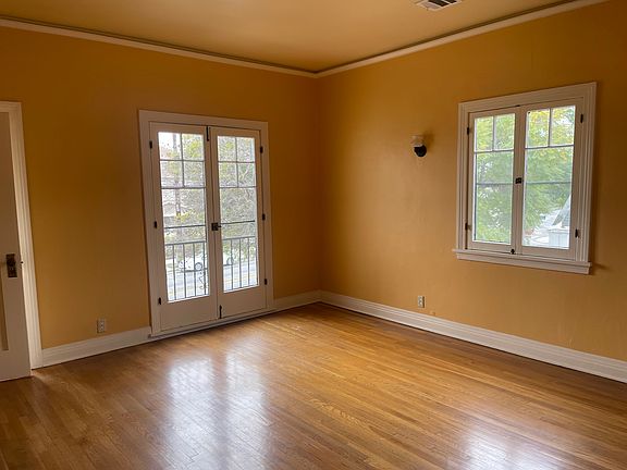 Large living room facing front of complex, light and bright