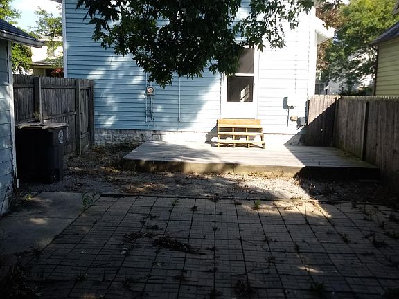 Your backyard has a deck, is tree-covered, and is completely fenced in!