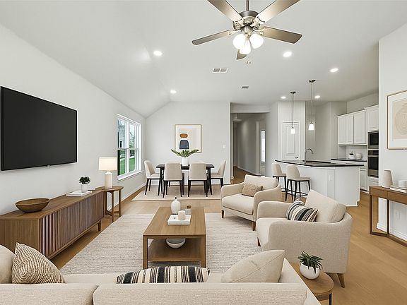 Open concept living and dining area with high ceilings and plenty of natural light!