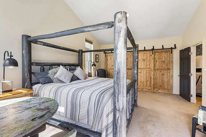 Ensuite bedroom with king bed on main level
