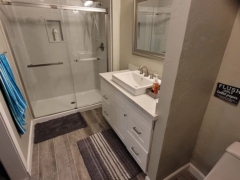 Master bath with walk in shower and quartz shower bath surround