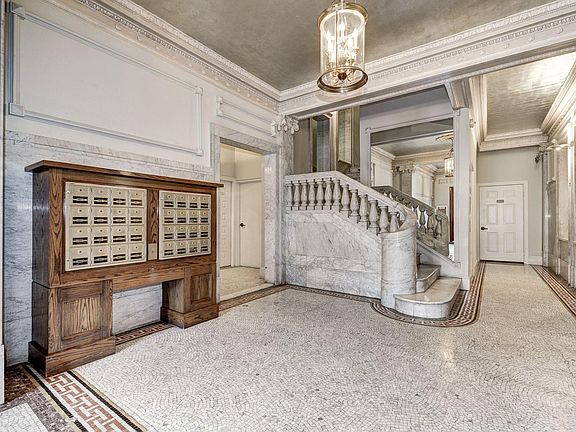 Majestic entrance hallway with white marble