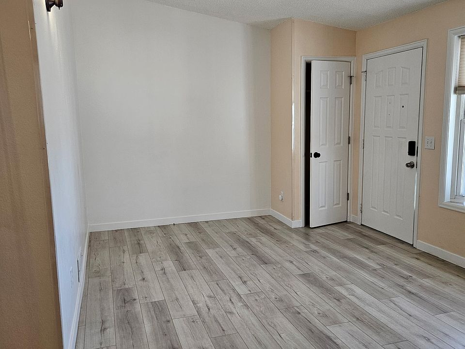 living room, closet and front door