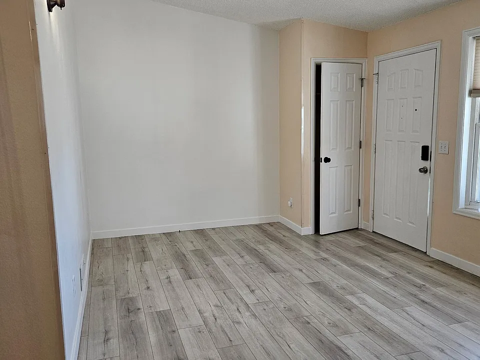 living room, closet and front door