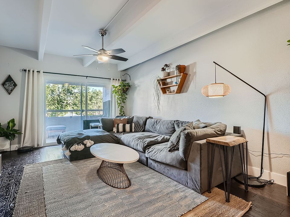 Spacious living room with sliding door access to West facing patio.