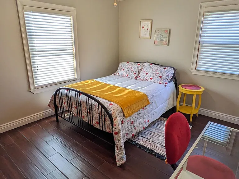 Second bedroom, first floor. In addition to desk shown, has armoire/chest of drawers (not shown) and closet.
