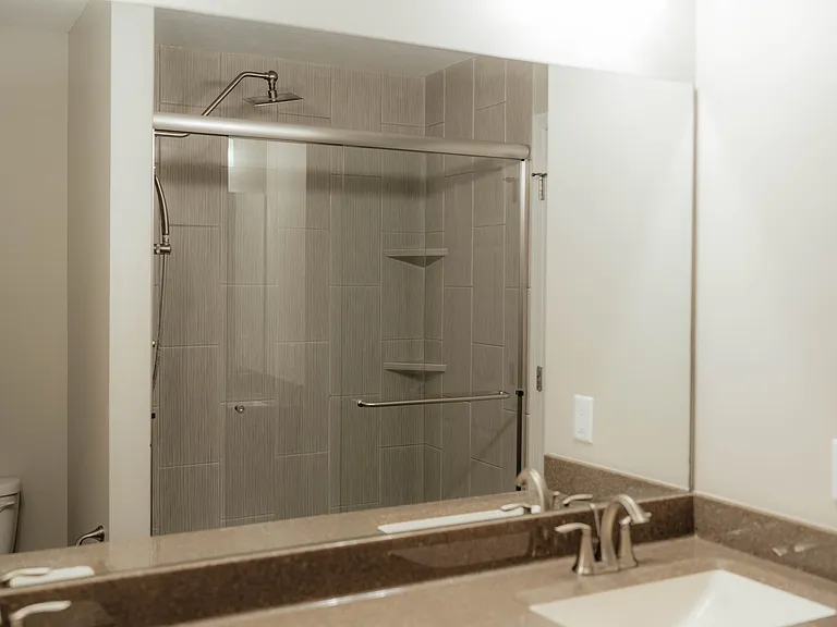 Gorgeous walk in shower with large shower head.