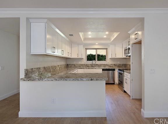 The new kitchen looks right out the dining and living room.  Very nice green belt view from all areas.
