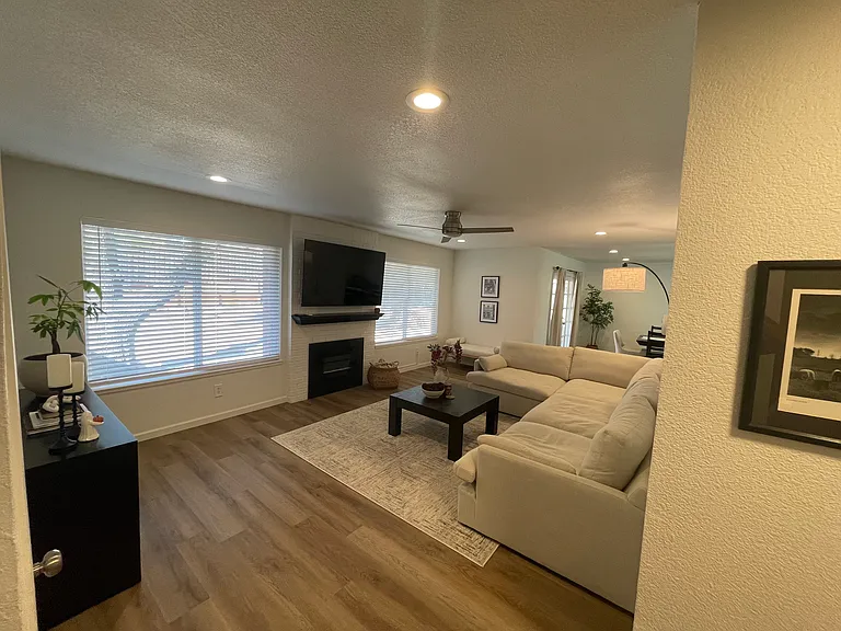 Open family room with electric fireplace