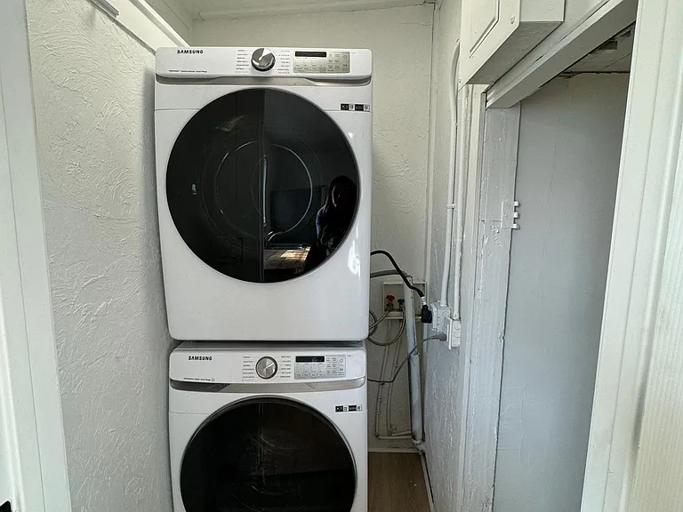 Convenient in-unit stacked washer and dryer tucked away for easy everyday use.