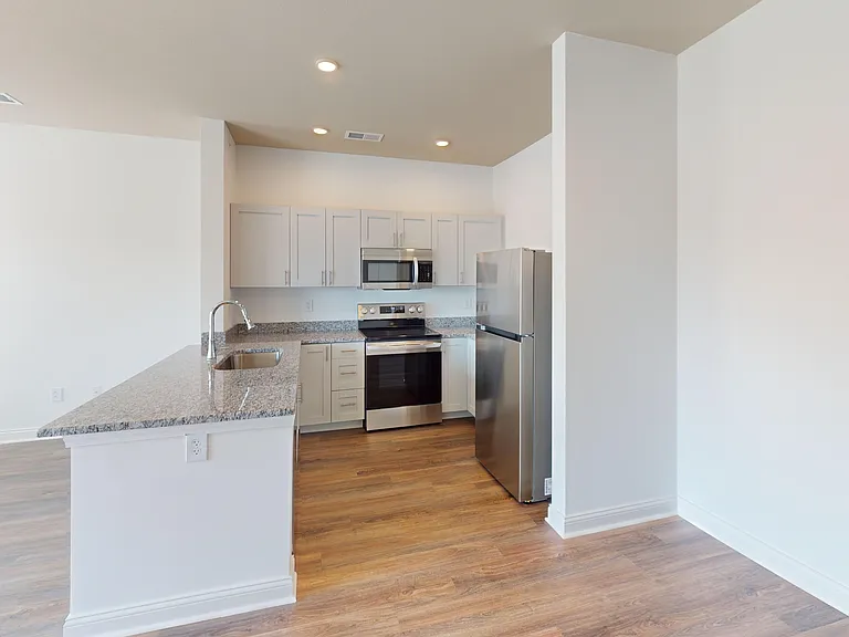 The Alfred floor plan has an open-concept floor plan with easy flow between the kitchen, dining area, and living space. The Alfred floor plan has an open-concept floor plan with easy flow between the kitchen, dining area, and living space.