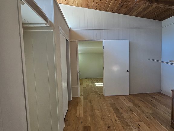 Bedroom looking into extra room