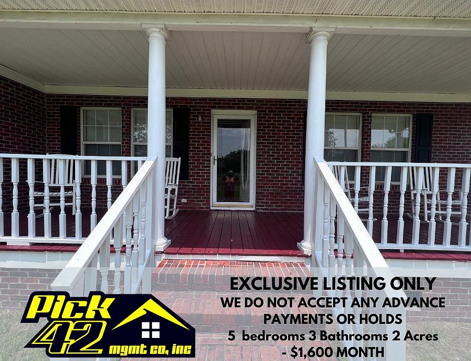 Front Porch - with 4 white rocking chairs.