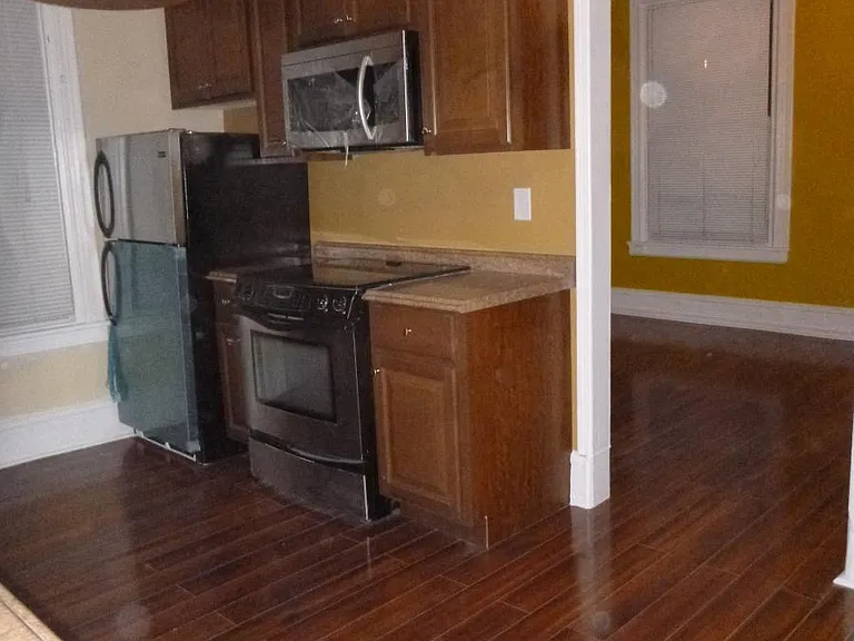Kitchen with Hardwood floor and stainless appliances