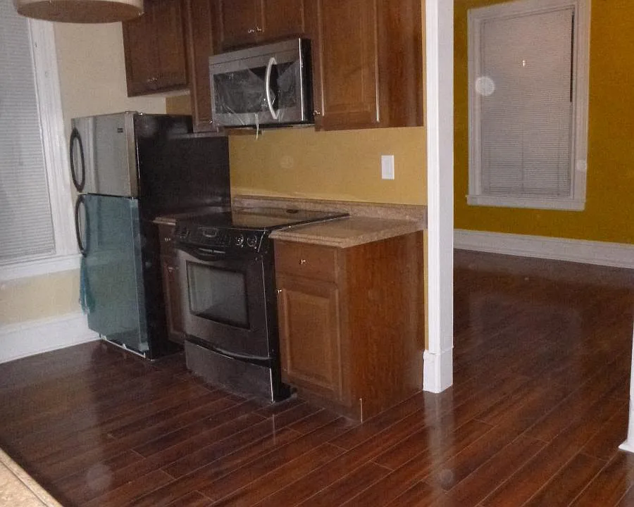 Kitchen with Hardwood floor and stainless appliances