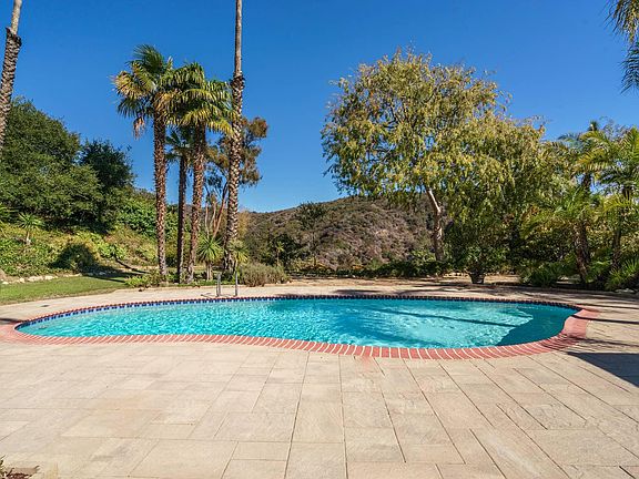 Feels like a private escape!, Pool and large backyard with grass and hiking trails below