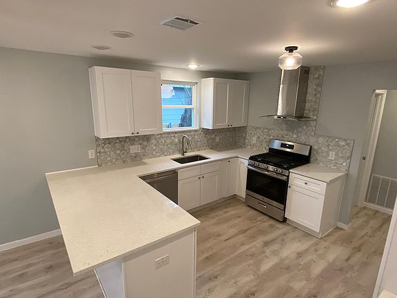 Kitchen features all new cabinets and countertops. Gas stove.