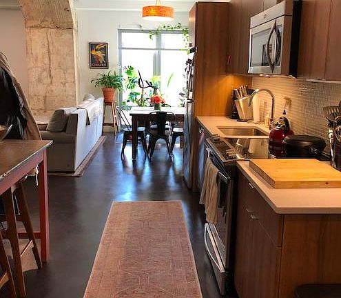 Kitchen with quartz countertops and stainless steel appliances