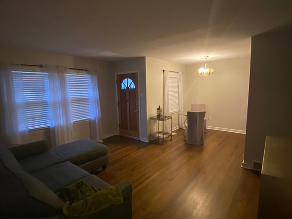View of living room leading into dining room.