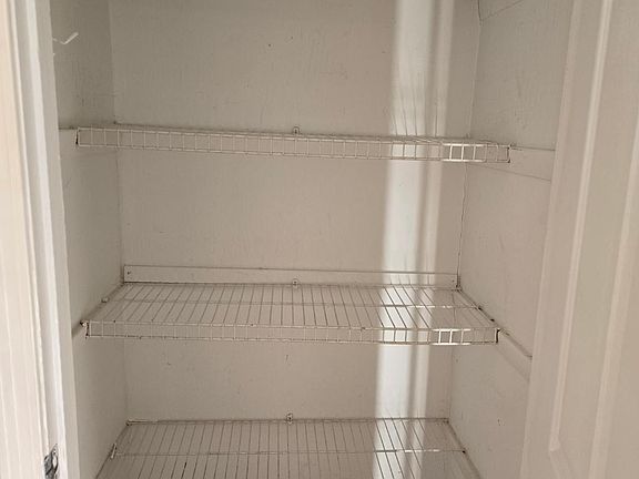 Linen closet next to bathroom