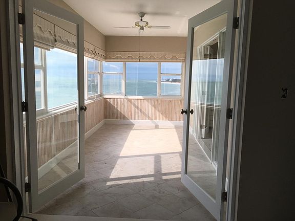 french doors to enclosed balcony