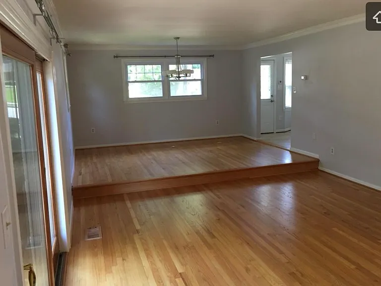 Dining room and living room with slider to backyard