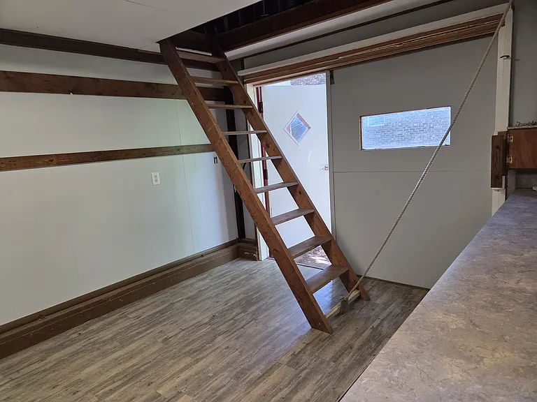 There is a large loft in the barn that is accessed through a pull down stair way