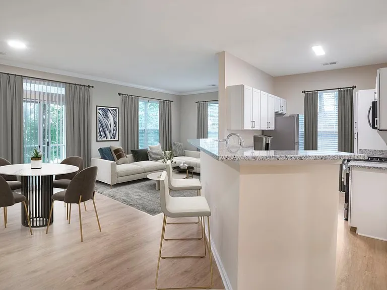 Renovated Package II kitchen and living room with hard surface flooring