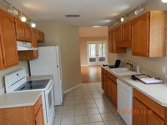 self-cleaning oven, refrigerator, dishwasher and garbage disposal.